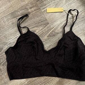 SKIMS logo triangle bralette